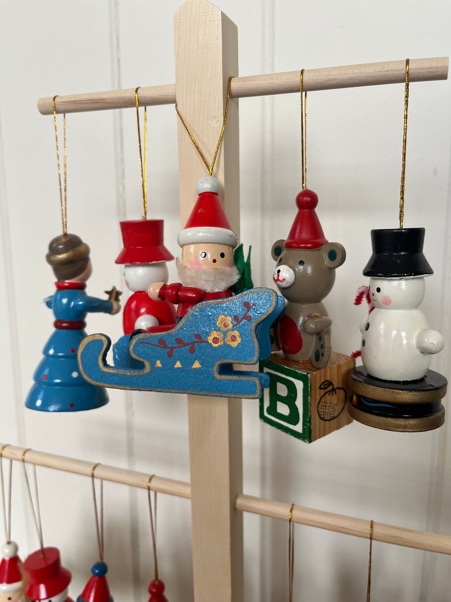 Vintage wooden Santas in sleighs
