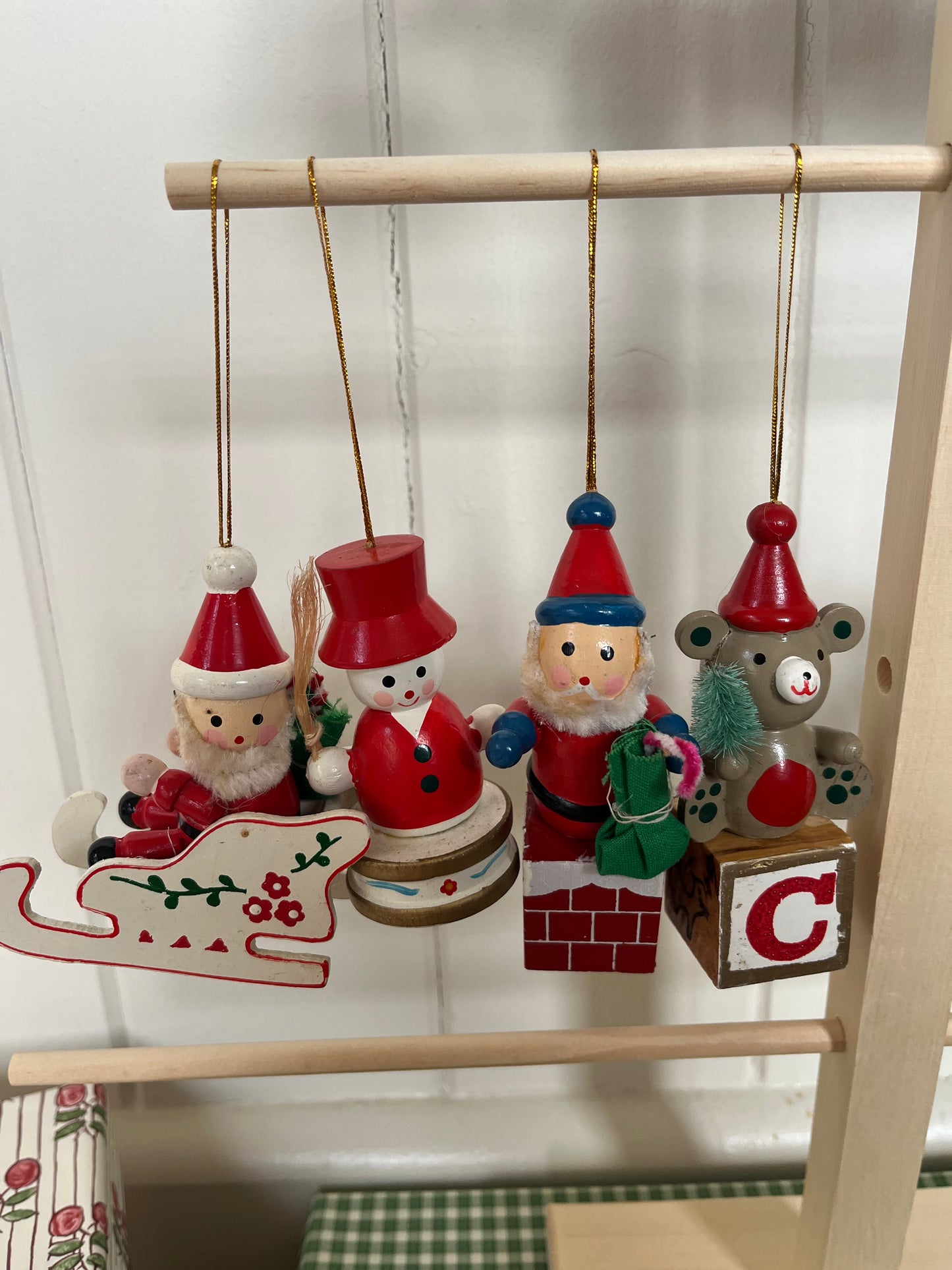 Vintage wooden Santas in sleighs