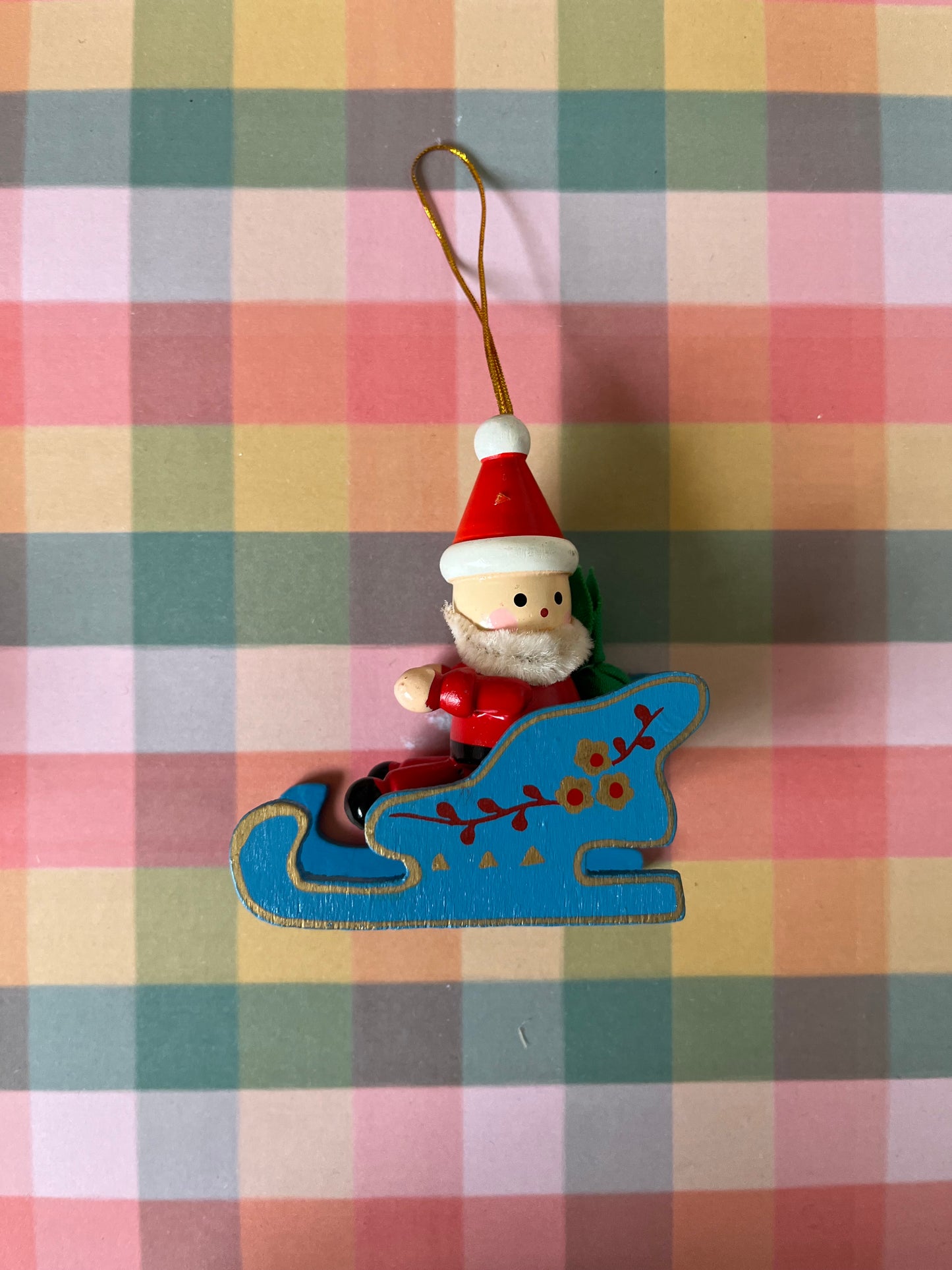 Vintage wooden Santas in sleighs