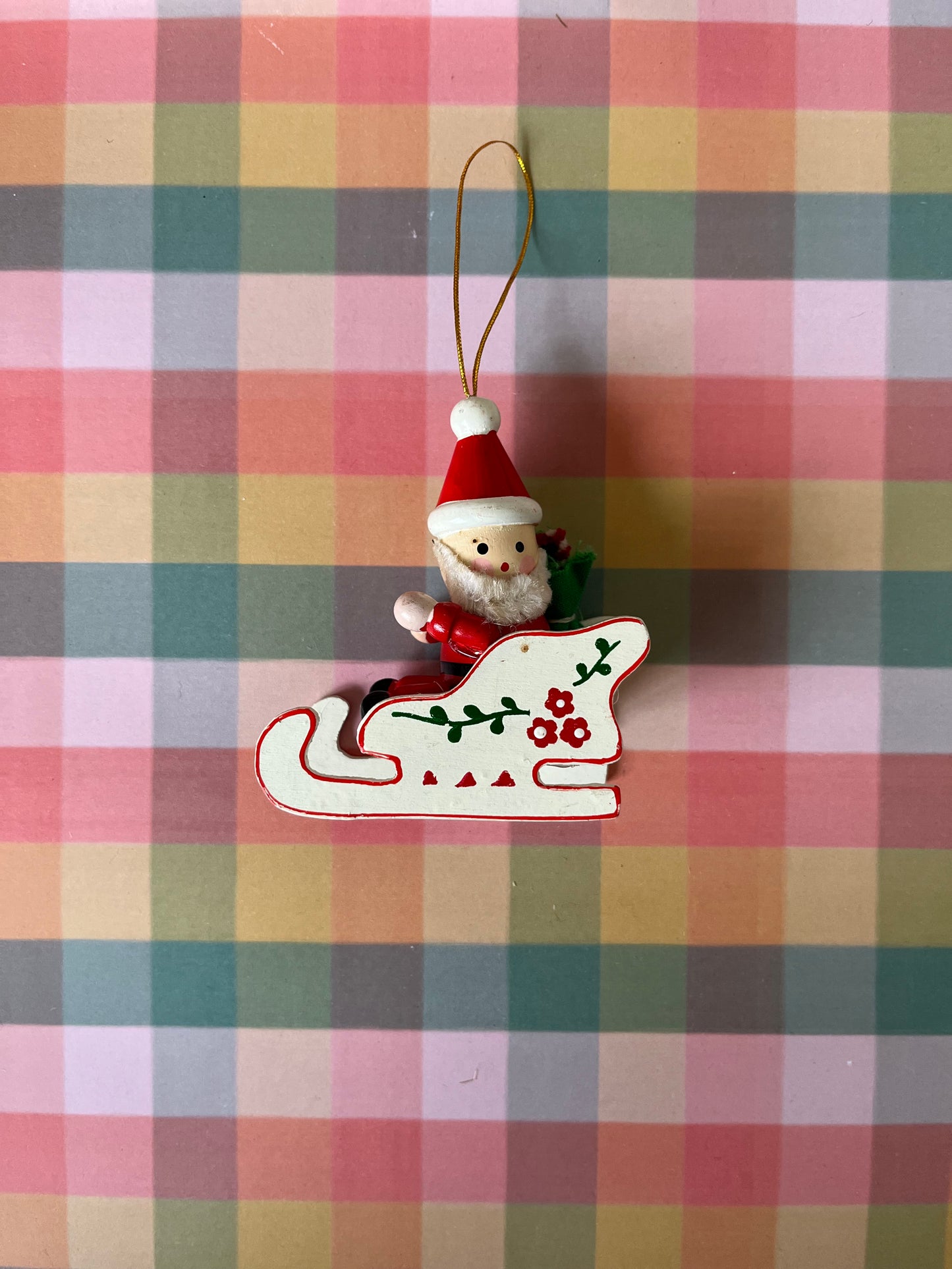 Vintage wooden Santas in sleighs