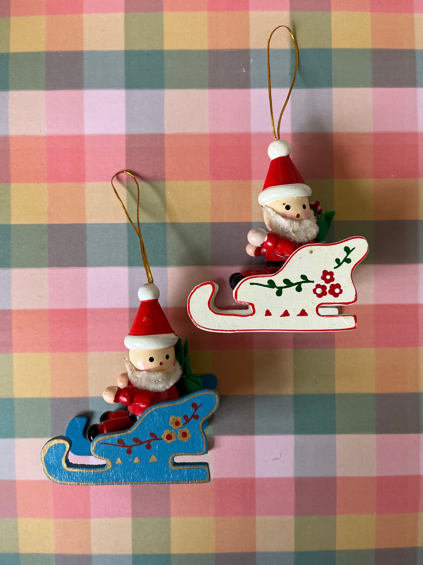 Vintage wooden Santas in sleighs